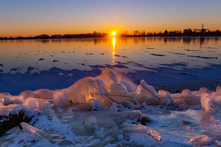 Surise and ice near a windmill in Haarlem